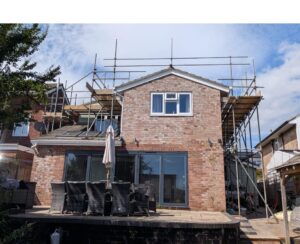 Two-storey property in Fareham with scaffolding erected for solar panel installation
